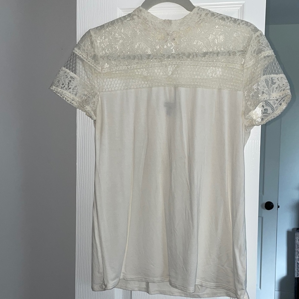 White short sleeve lace/cotton top.
